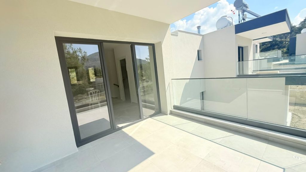 Private Balcony Private covered balcony with glass balustrade at Vesta Living Trimiklini