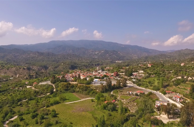 Wide view of Trimiklini village, valley and the main mountain road